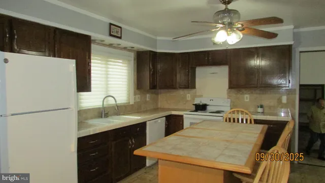 a view of a kitchen area with furniture