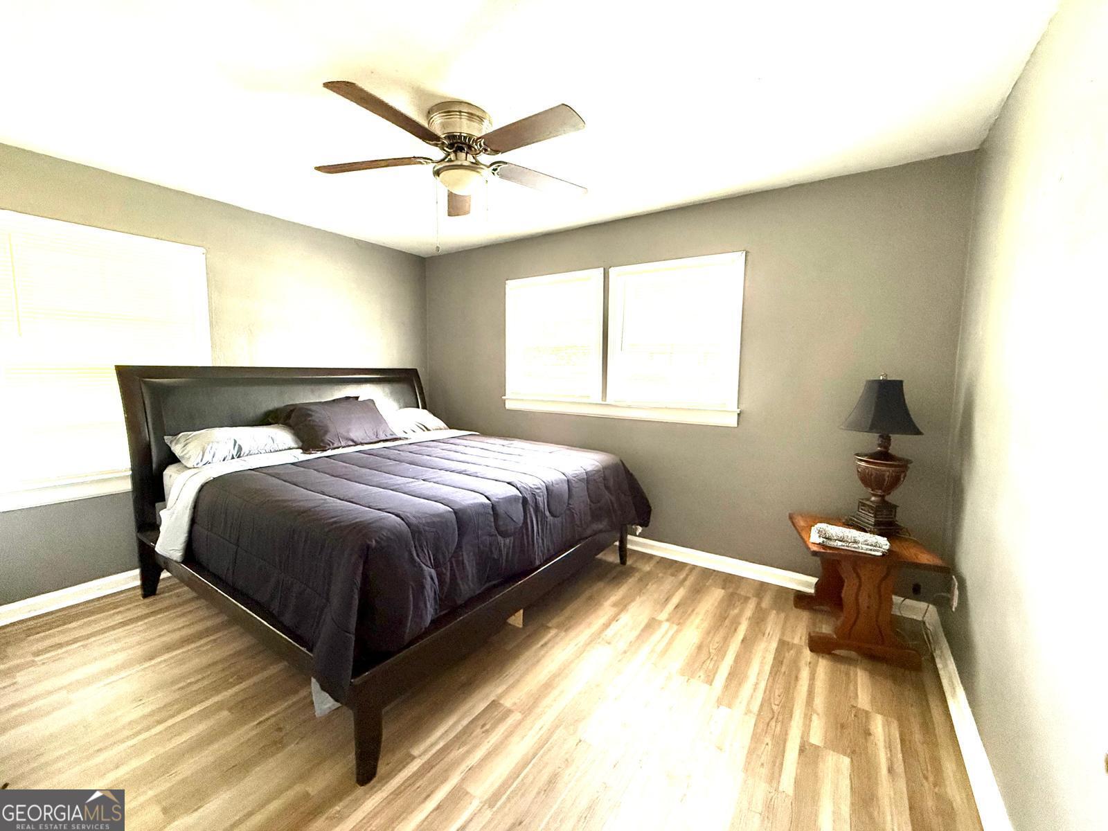 2602 Lake Ridge Circle Rome, GA 30165 - Photo 12 of 19 a bedroom with a bed and wooden floor