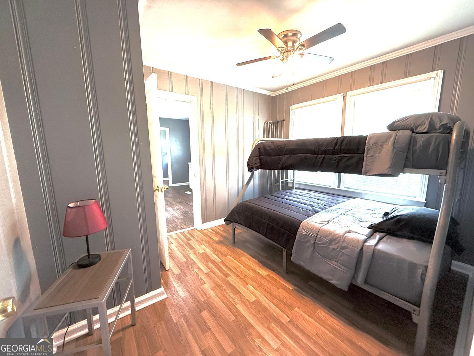 2602 Lake Ridge Circle Rome, GA 30165 - Photo 14 of 19 a bedroom with a bed and a chandelier