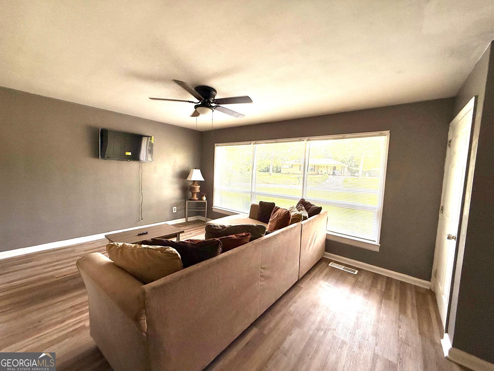 2602 Lake Ridge Circle Rome, GA 30165 - Photo 7 of 19 a living room with furniture and a large window