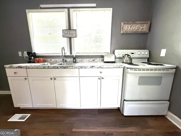 a room with a window and washer