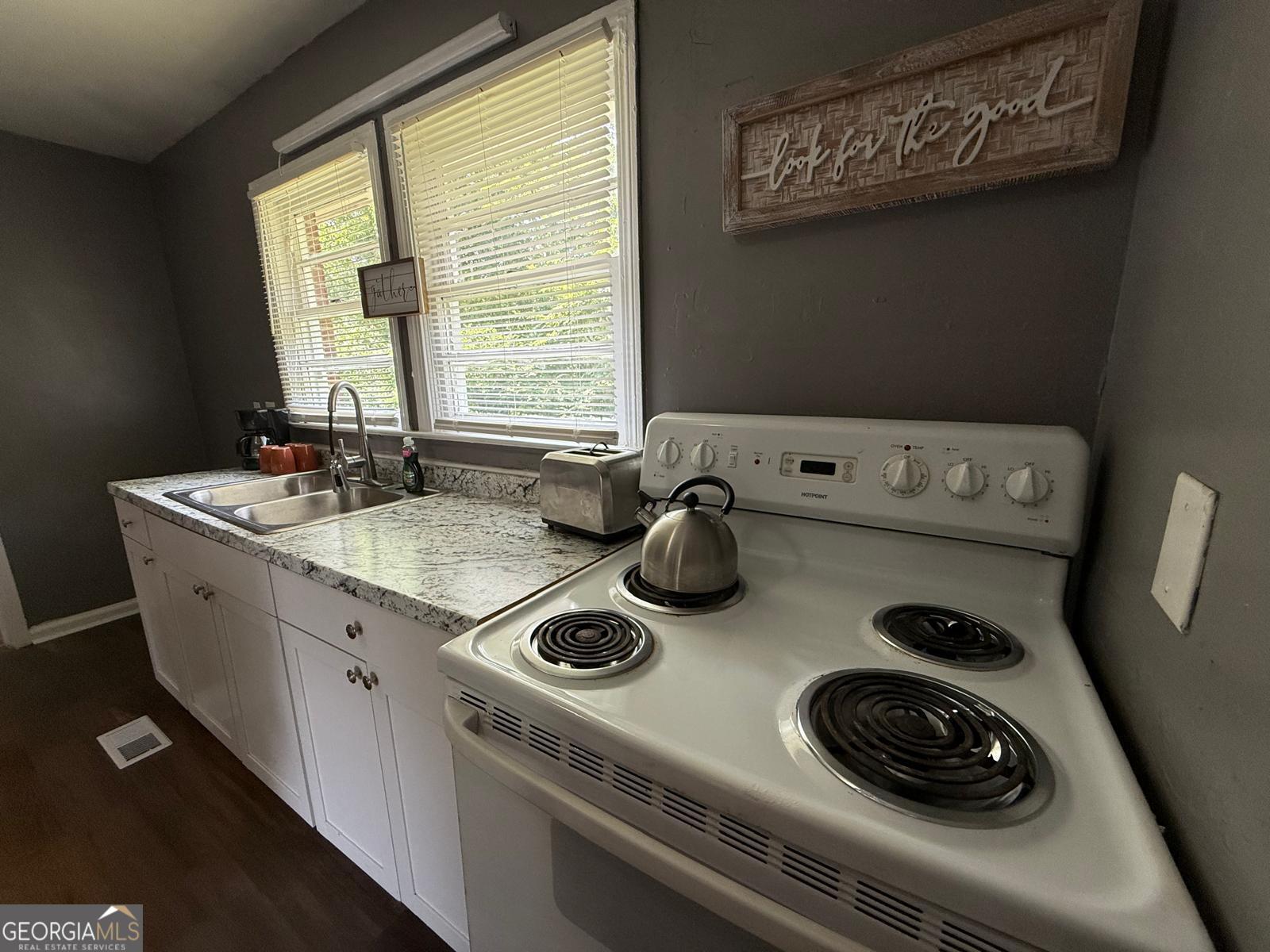 2602 Lake Ridge Circle Rome, GA 30165 - Photo 10 of 19 a kitchen with a stove and a sink