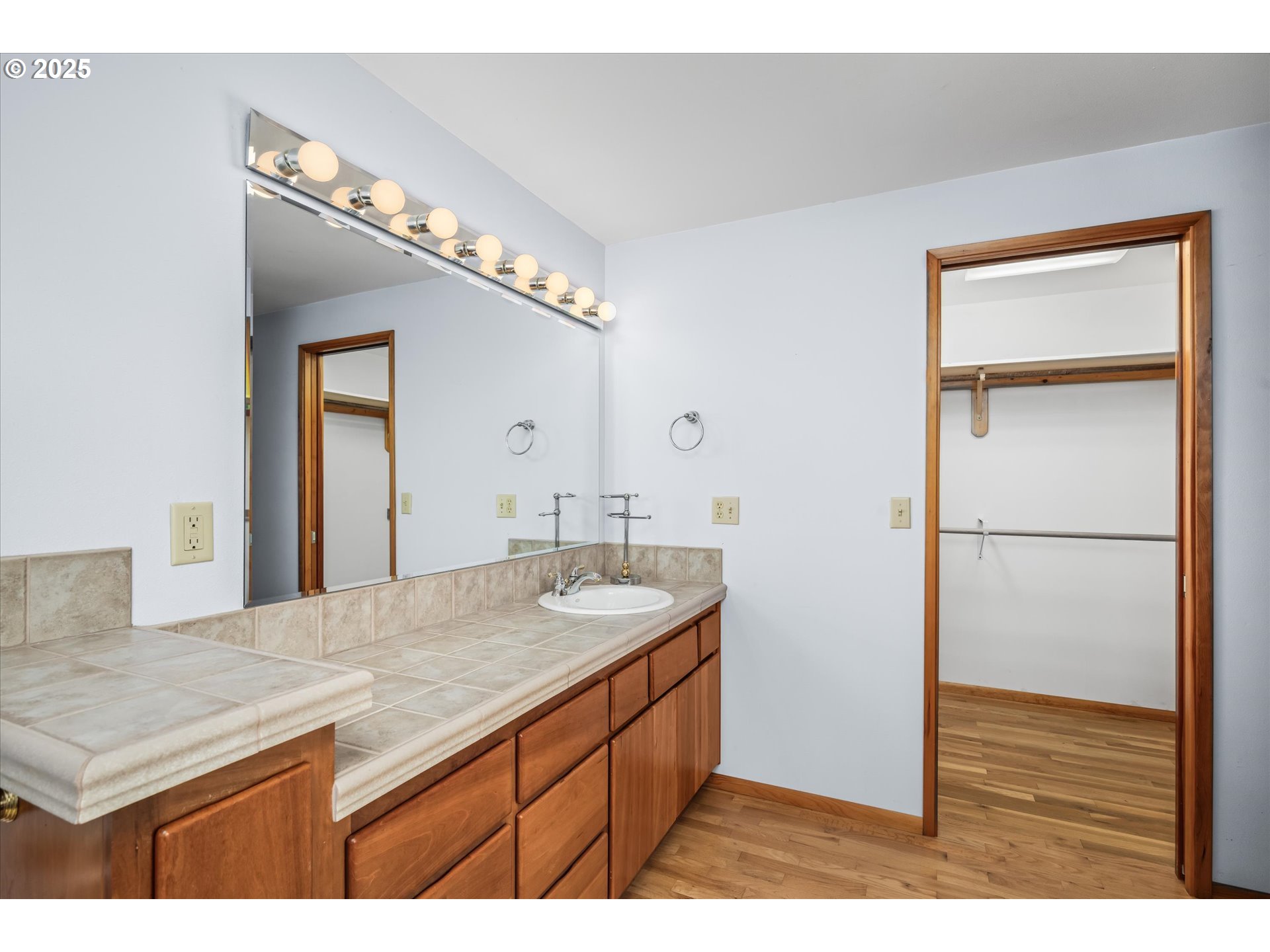 35012 McKenzie View Drive Springfield, OR 97478 - Photo 13 of 47 a bathroom with a granite countertop sink and a mirror