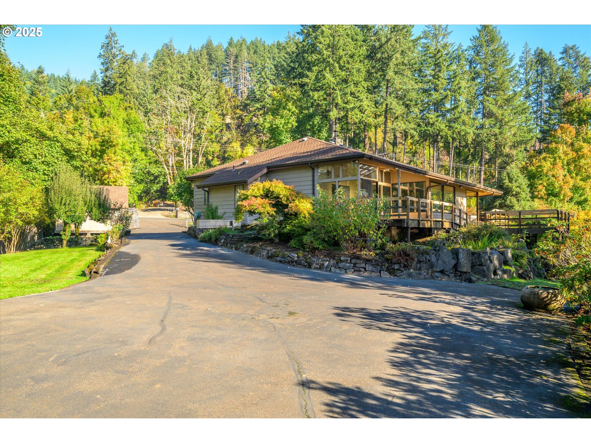 35012 McKenzie View Drive Springfield, OR 97478 - Photo 20 of 47 a yellow house with trees in front of it
