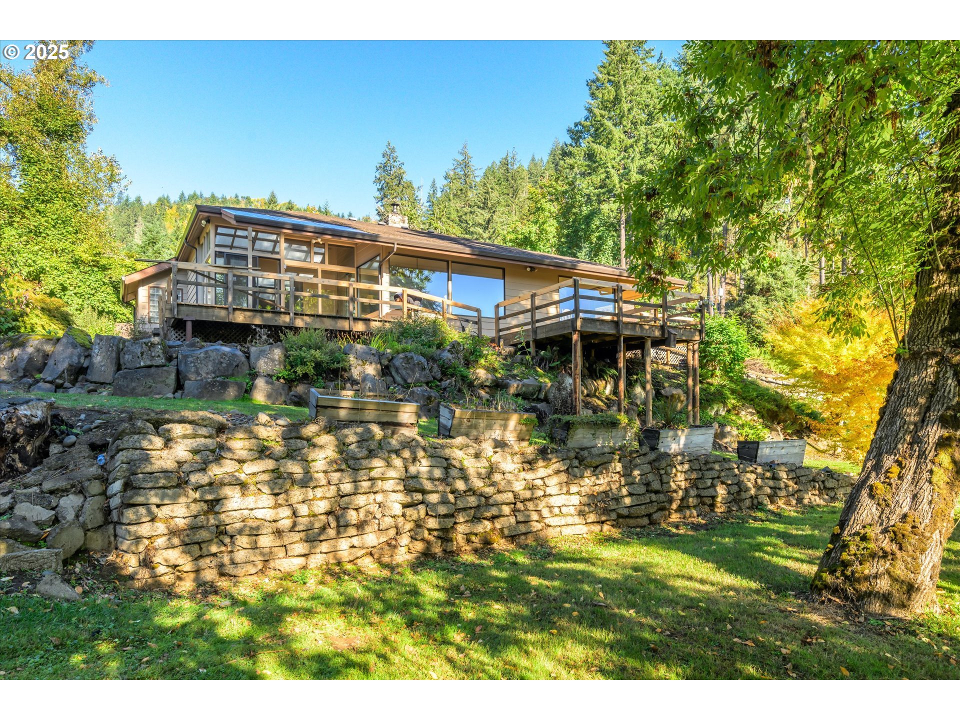 35012 McKenzie View Drive Springfield, OR 97478 - Photo 40 of 47 a backyard of a house with table and chairs