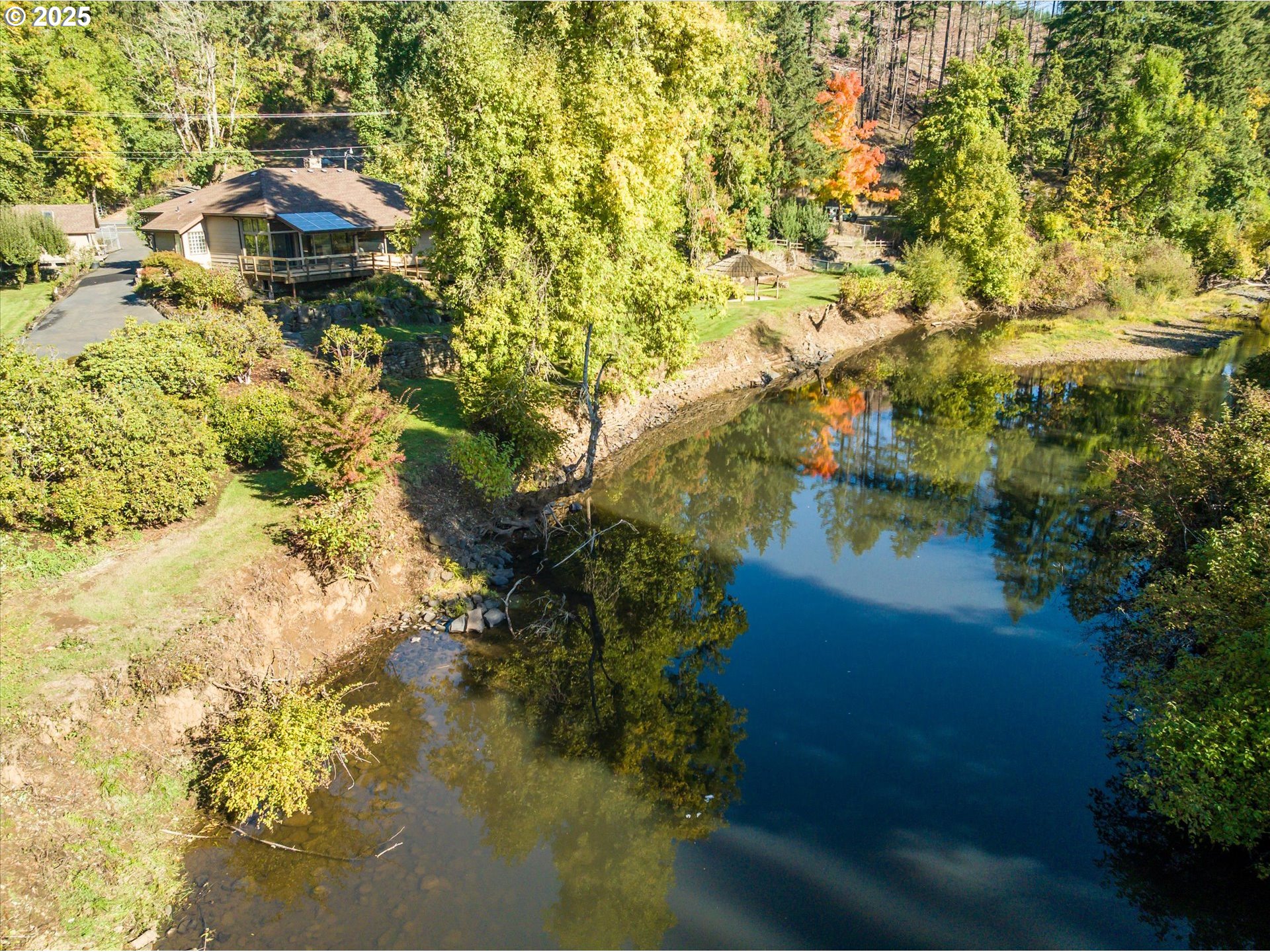 35012 McKenzie View Drive Springfield, OR 97478 - Photo 45 of 47 a backyard of a house with a yard and lake view