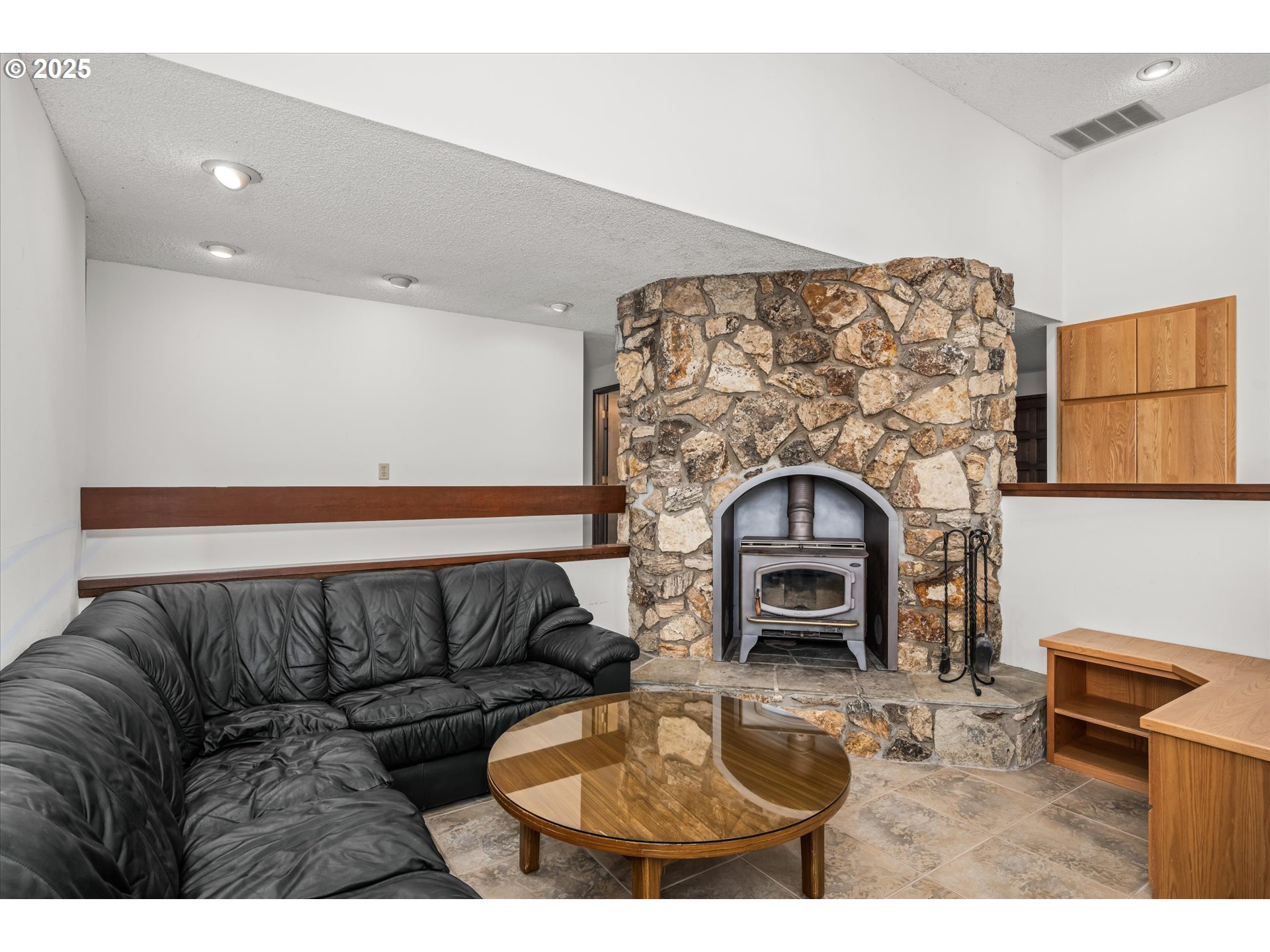35012 McKenzie View Drive Springfield, OR 97478 - Photo 7 of 47 a living room with furniture and a fireplace