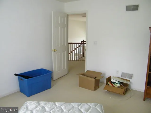 a bathroom with a sink vanity mirror and toilet