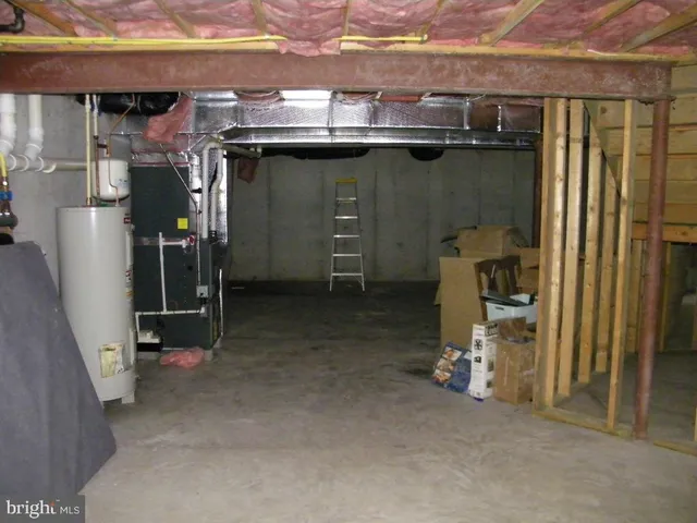 a bedroom with a bed and a table