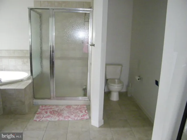 a view of a room with wooden walls