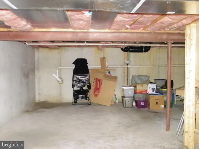 a view of a garage with parked cars