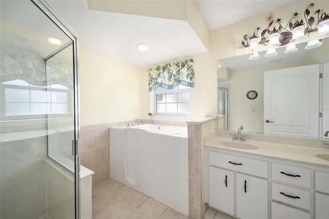a bathroom with a sink double vanity and shower