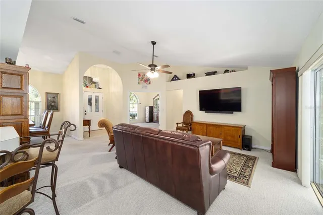 a living room with furniture and flat screen tv