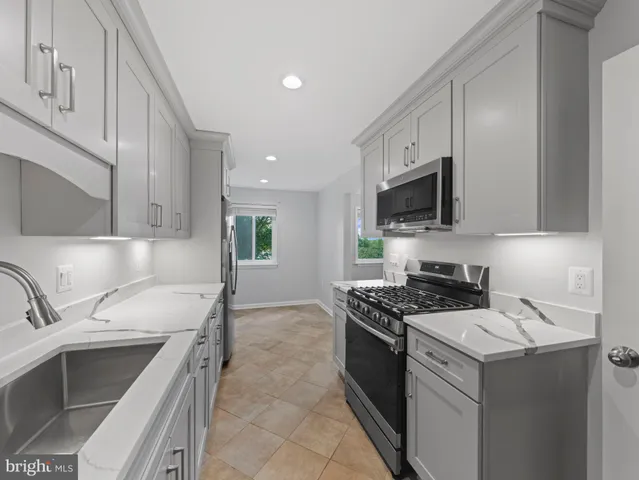 a bathroom with a double vanity sink and mirror