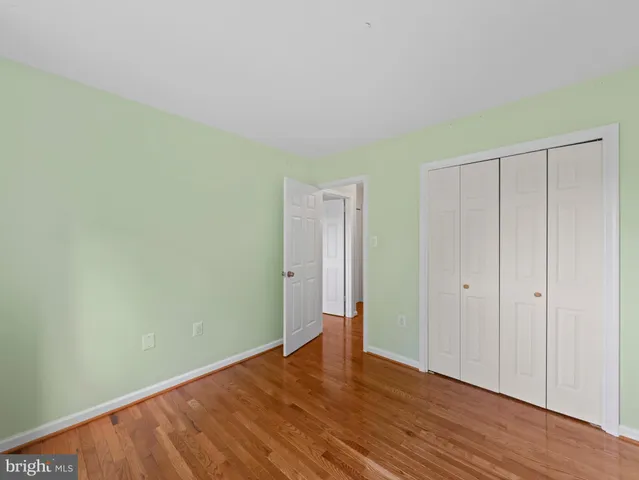 a living room with furniture a air conditioner and a window