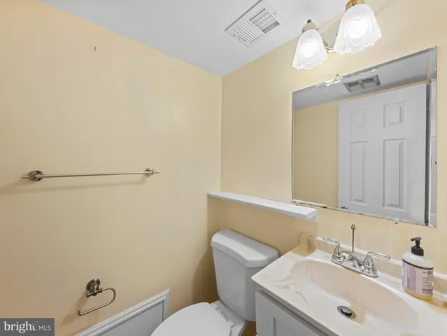 a view of a backyard with table and chairs and potted plants