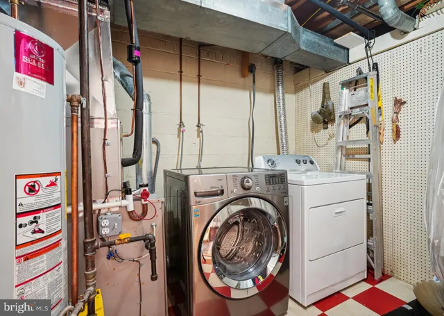 a front view of a house with yard and green space