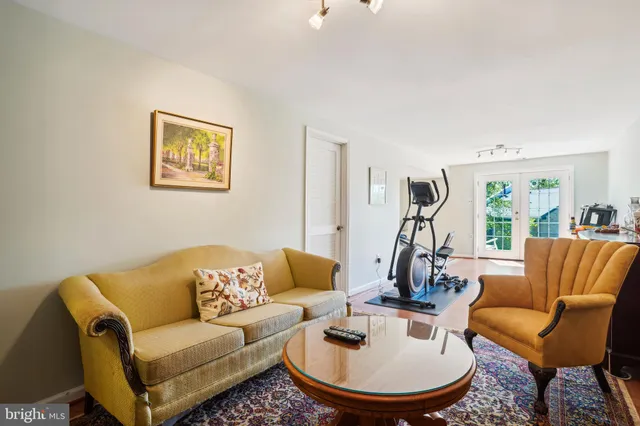 a view of a house with a yard and sitting area