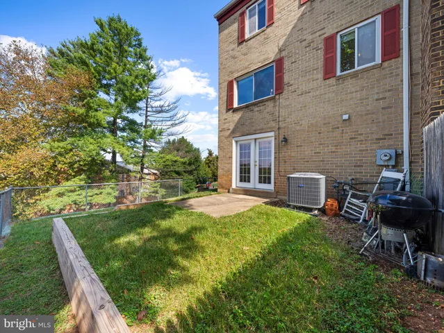 a swimming pool with outdoor seating and yard