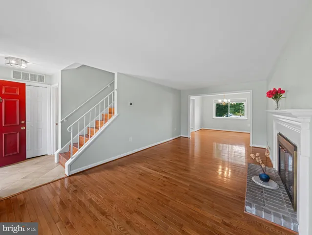 a bathroom with a sink mirror and toilet