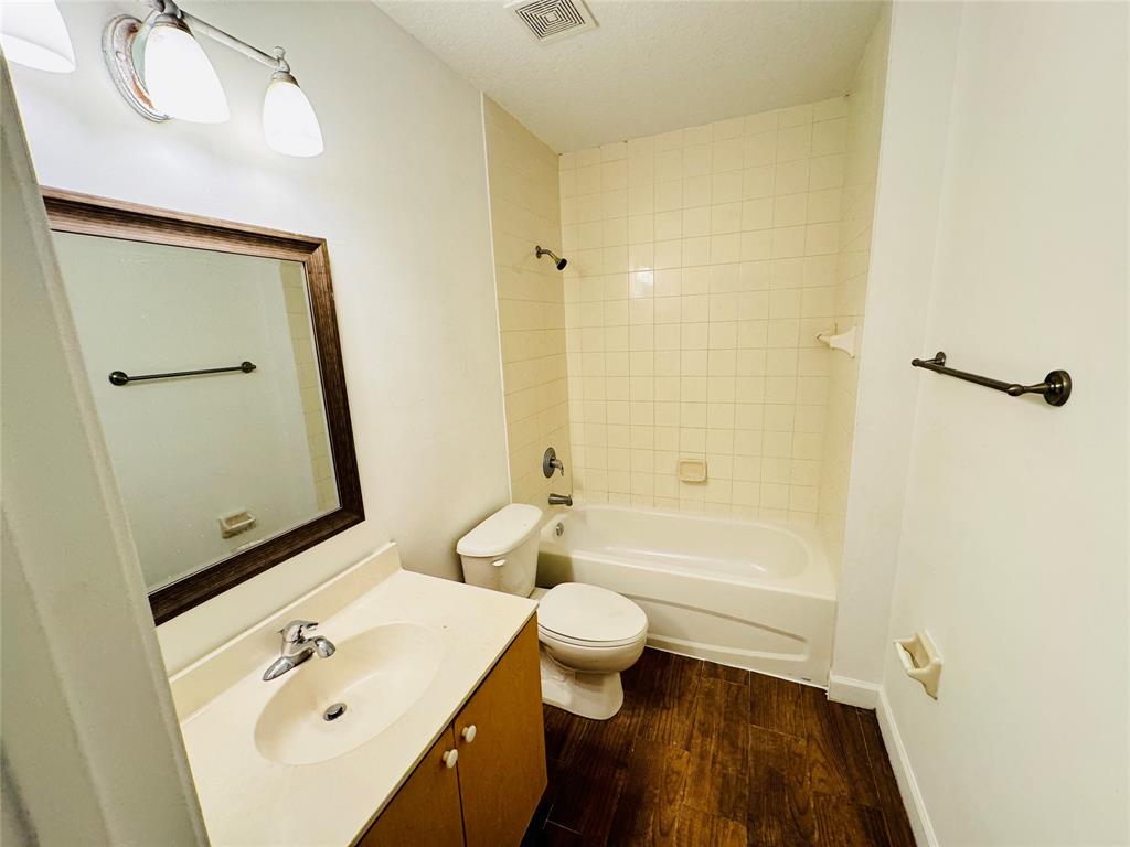 1157 Golden Lakes Boulevard, Unit 622 West Palm Beach, FL 33411 - Photo 12 of 19 a bathroom with a sink a toilet and shower
