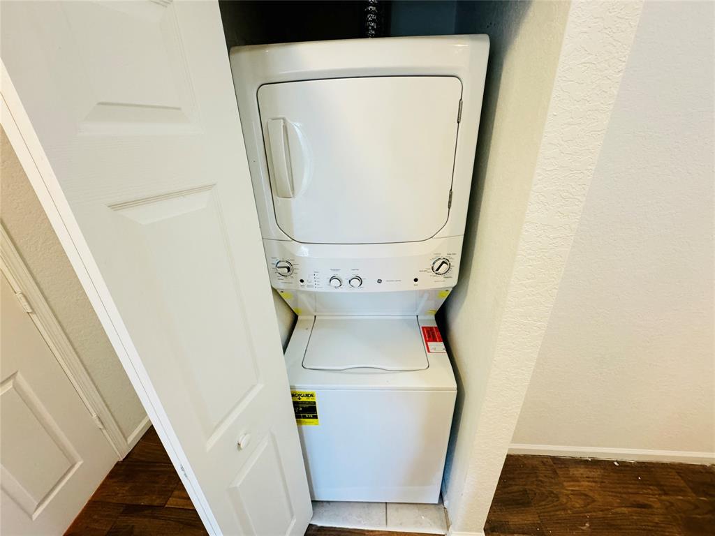 1157 Golden Lakes Boulevard, Unit 622 West Palm Beach, FL 33411 - Photo 13 of 19 a utility room with dryer and washer
