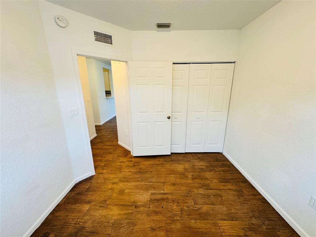 1157 Golden Lakes Boulevard, Unit 622 West Palm Beach, FL 33411 - Photo 15 of 19 a view of empty room with wooden floor