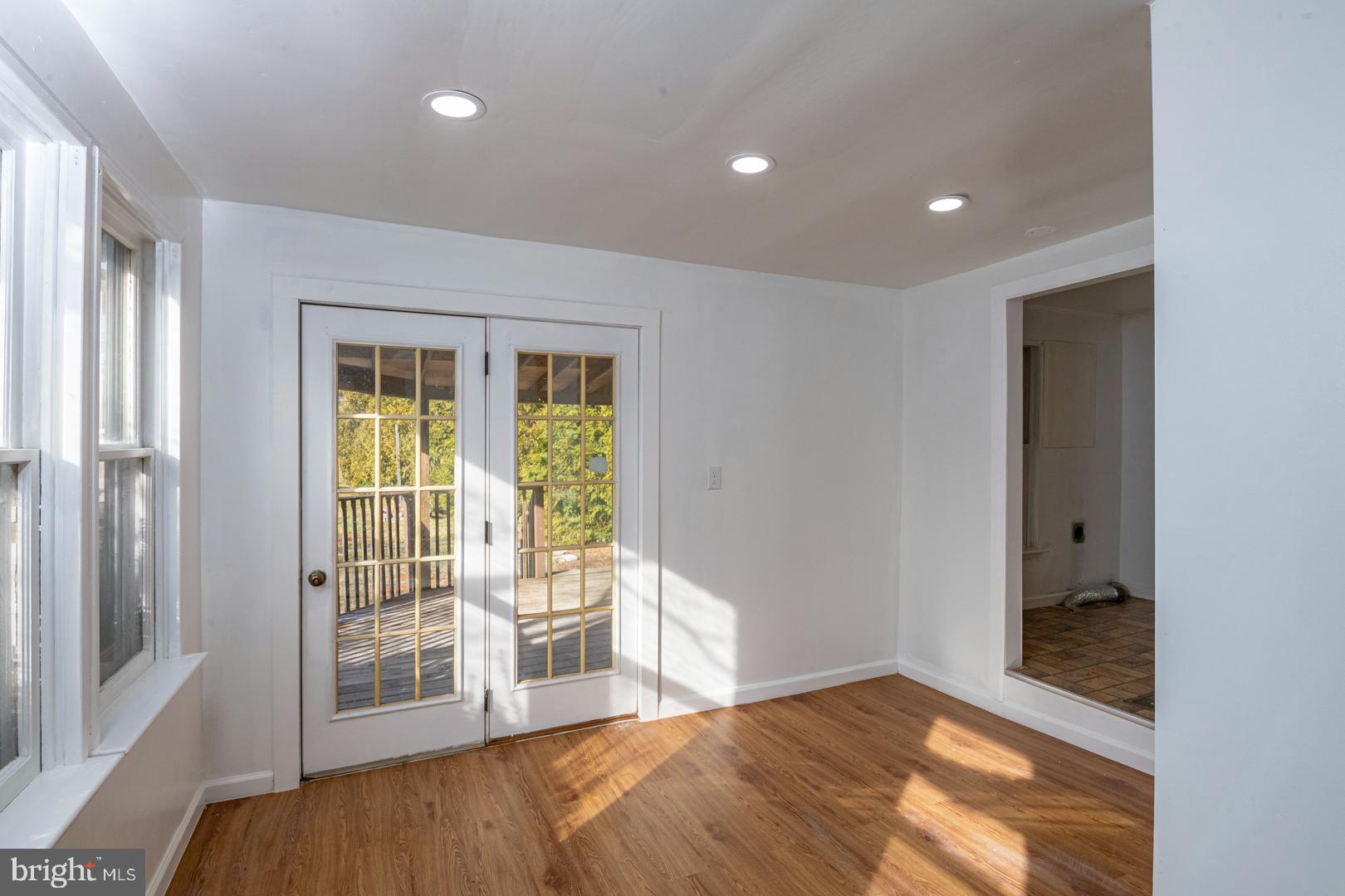 202 Water Street Oley, PA 19547 - Photo 13 of 30 a view of a bedroom with wooden floor and windows