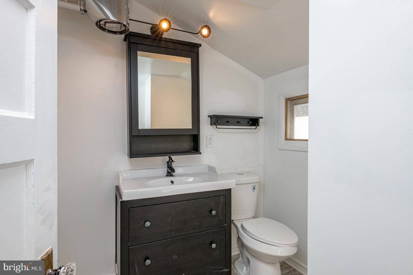 202 Water Street Oley, PA 19547 - Photo 15 of 30 a bathroom with a toilet sink and mirror