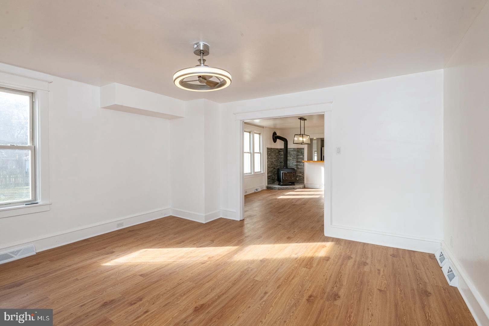 202 Water Street Oley, PA 19547 - Photo 6 of 30 a view of a room with wooden floor and large window