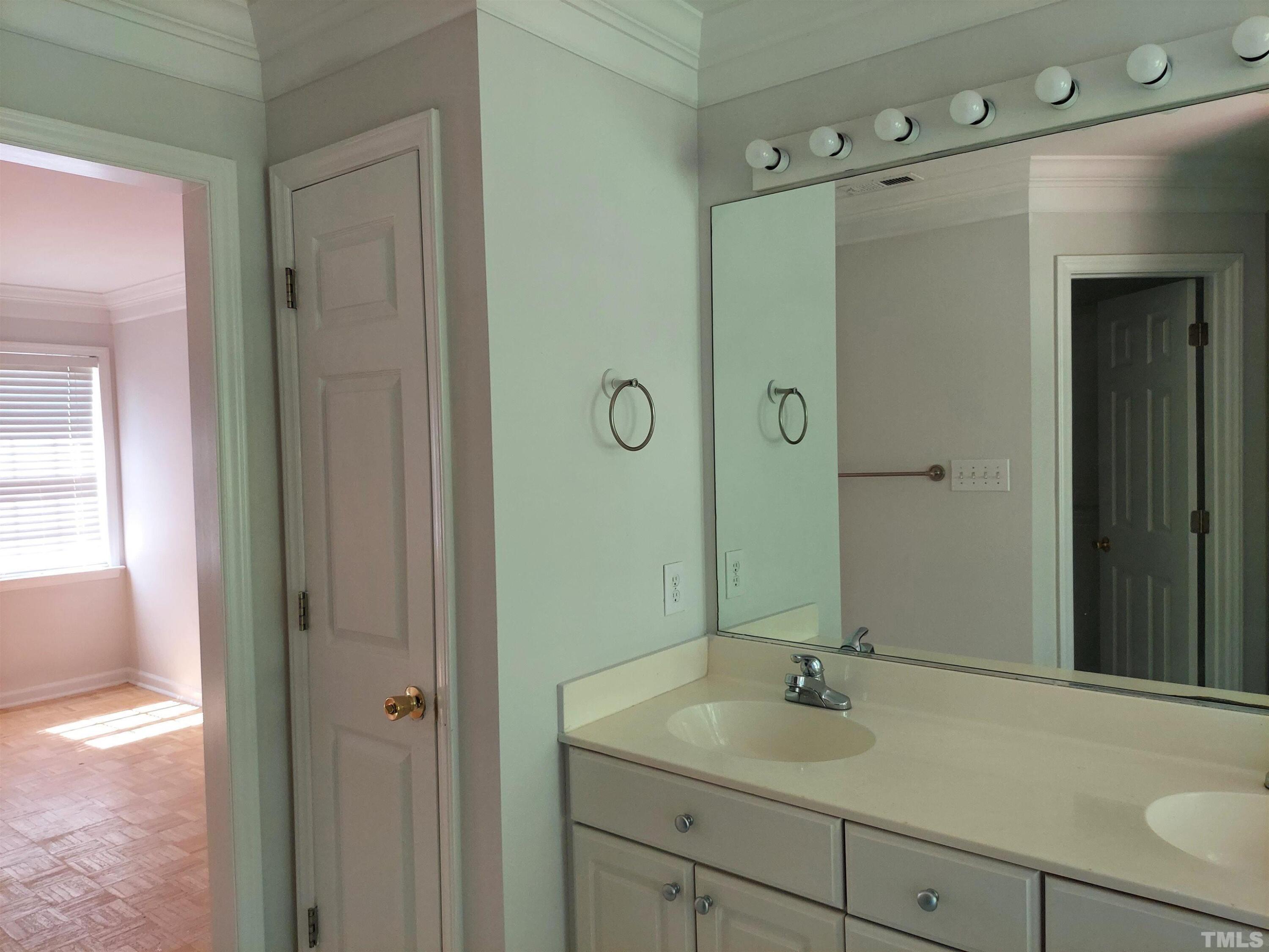 224 Crossfire Road Holly Springs, NC 27540 - Photo 20 of 43 a bathroom with a sink and a mirror