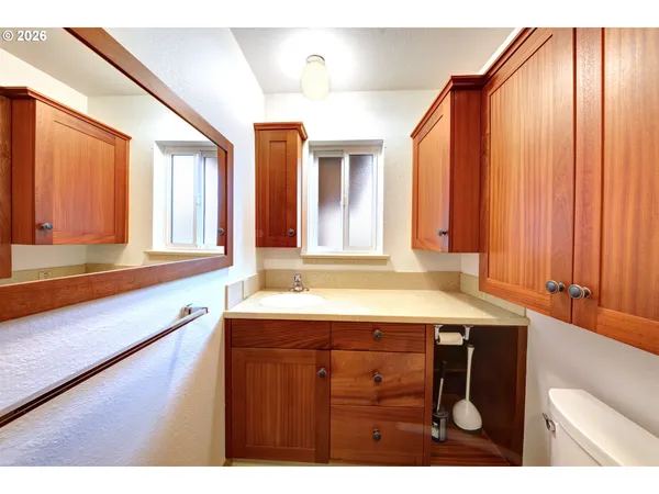 a kitchen with a sink a counter top space and a window