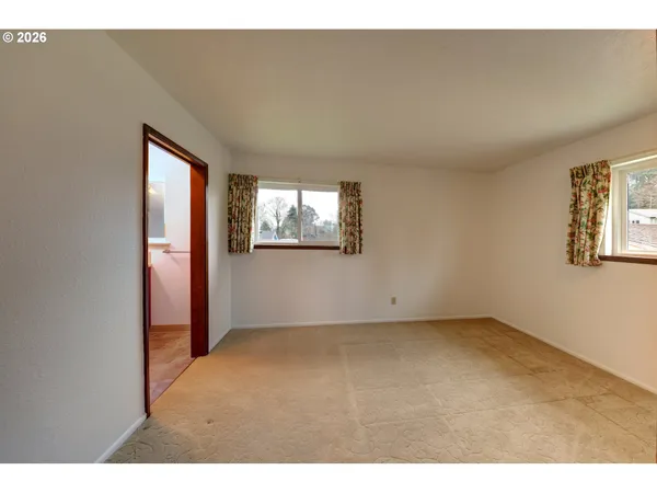 a view of empty room with windows