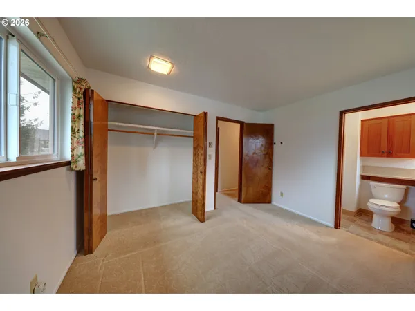 a view of empty room with a fireplace