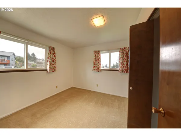 a view of empty room with windows