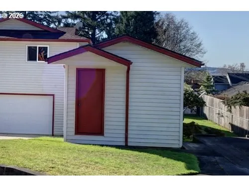 a view of a backyard of the house