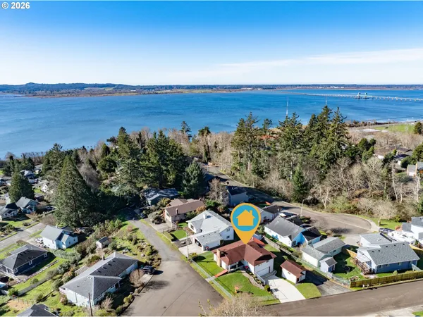 an aerial view of a house with a swimming pool