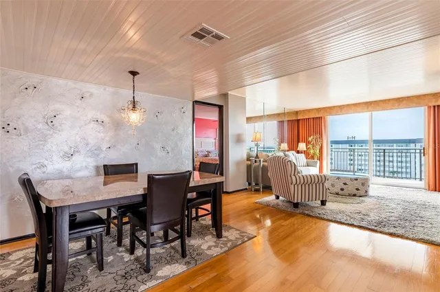 a view of a dining room with furniture window and outside view