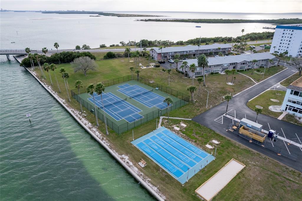 9 Haig Place, Unit 801 Dunedin, FL 34698 - Photo 35 of 36 an aerial view of a house with a lake