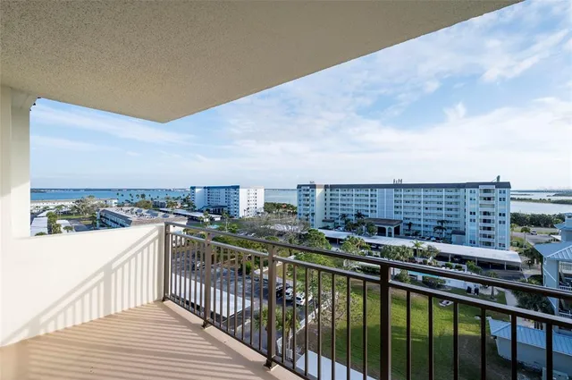 a view of a balcony with city
