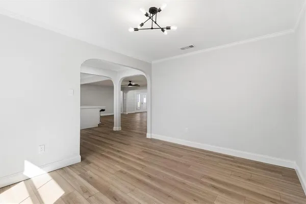 a view of a room with wooden floor and staircase