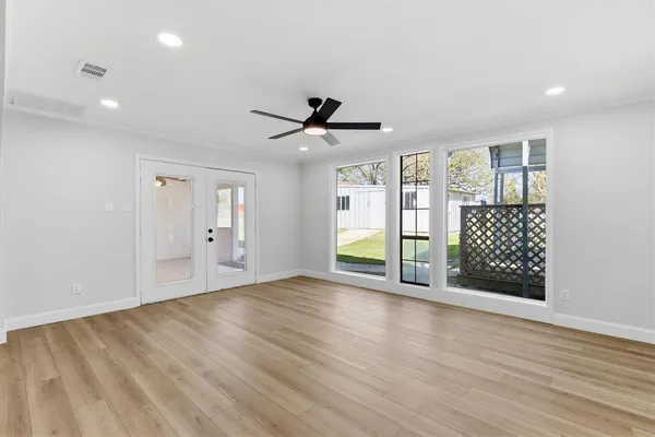 a view of an empty room with a window