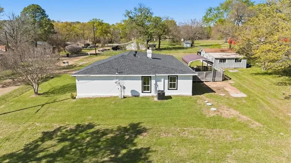 a aerial view of a house with a yard