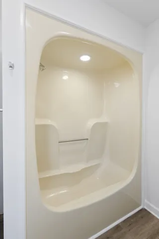 a bathroom with a sink vanity granite and a mirror