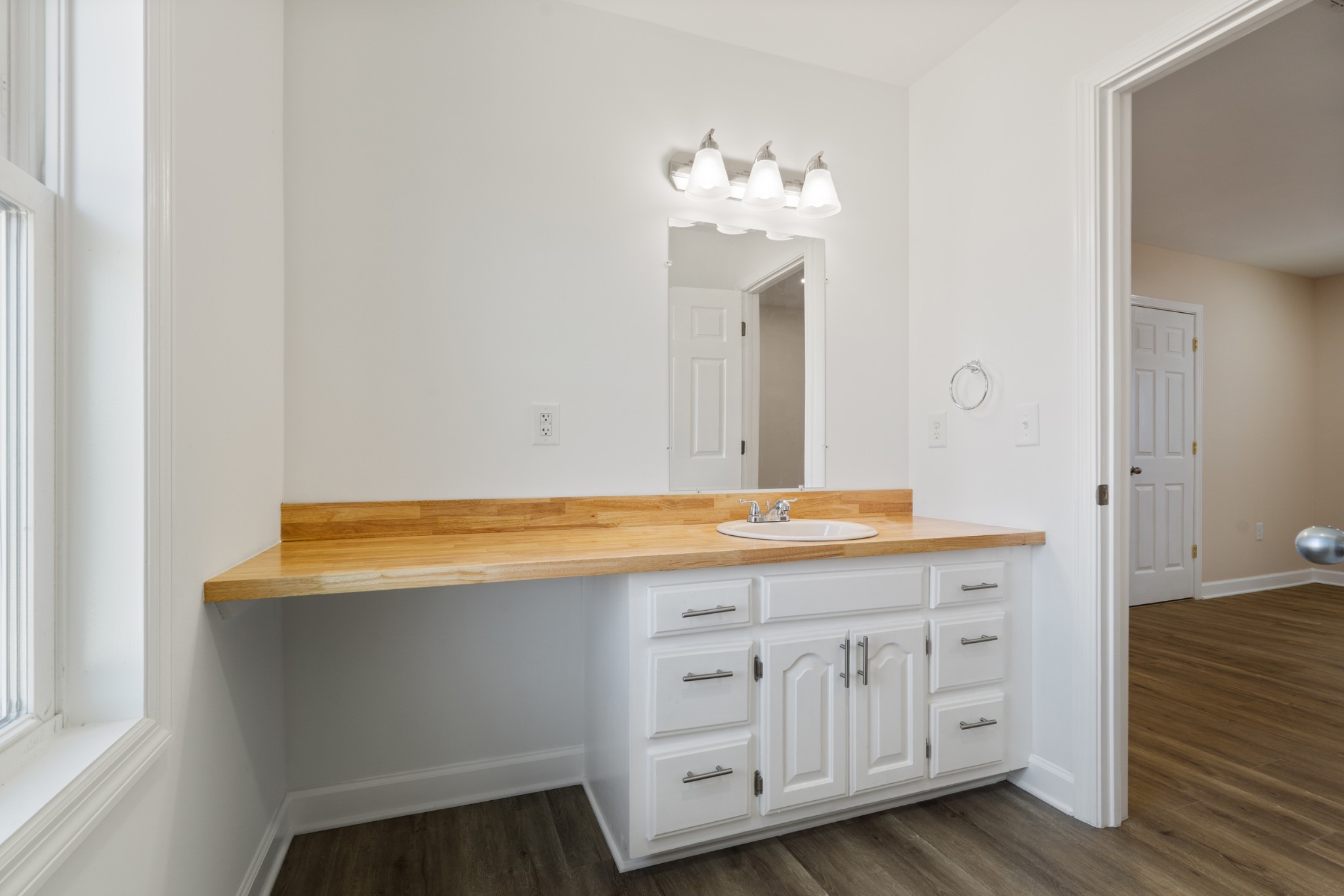 654 West Main Street Hohenwald, TN 38462 - Photo 14 of 33 a room with cabinets and wooden floor
