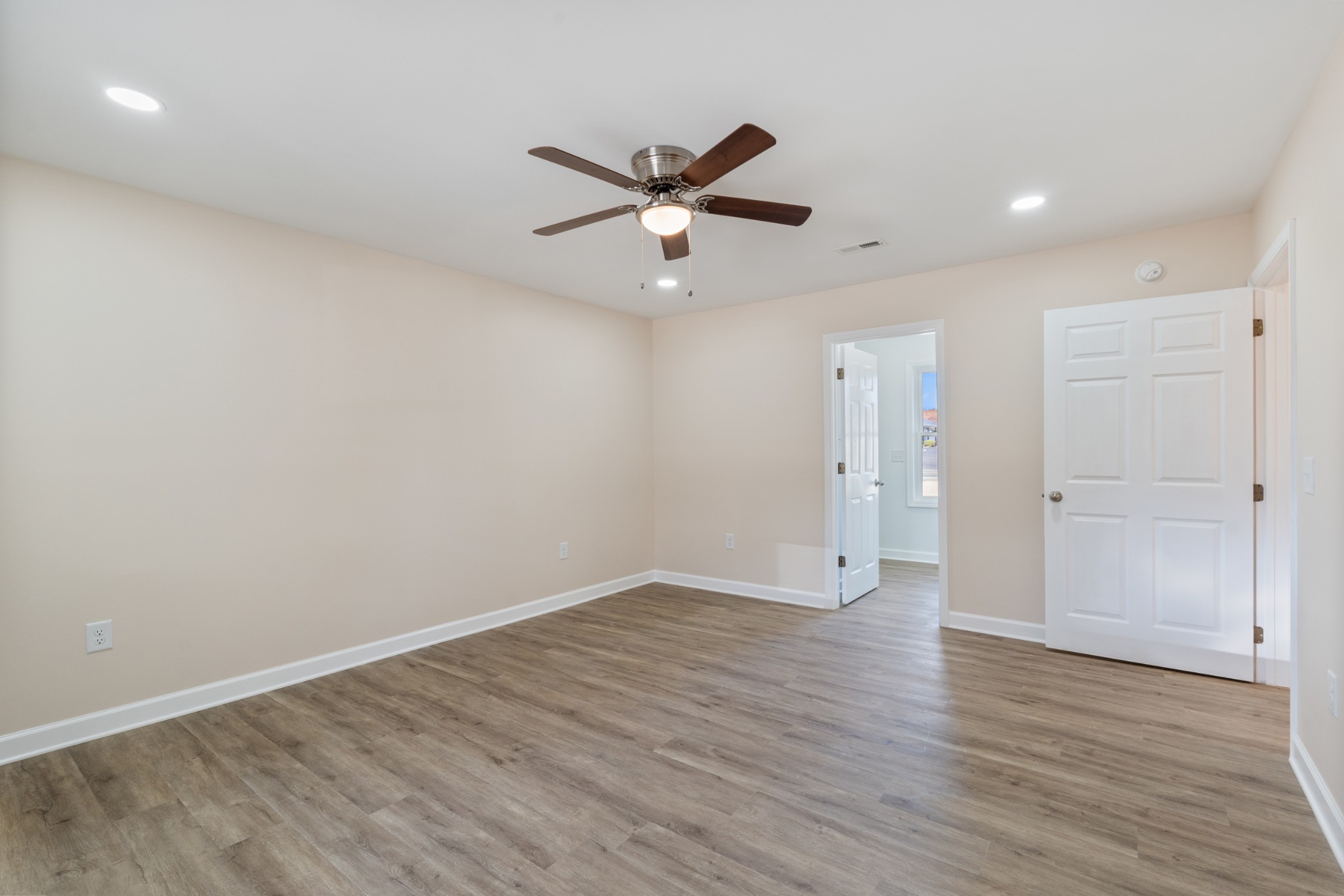 654 West Main Street Hohenwald, TN 38462 - Photo 16 of 33 wooden floor in an empty room