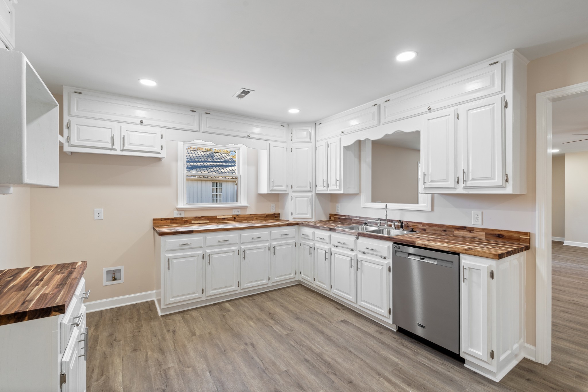 654 West Main Street Hohenwald, TN 38462 - Photo 20 of 33 a kitchen with stainless steel appliances granite countertop a sink and cabinets