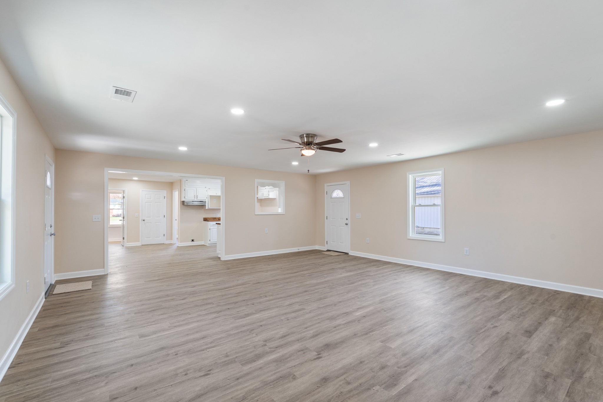 654 West Main Street Hohenwald, TN 38462 - Photo 27 of 33 wooden floor in an empty room with a window