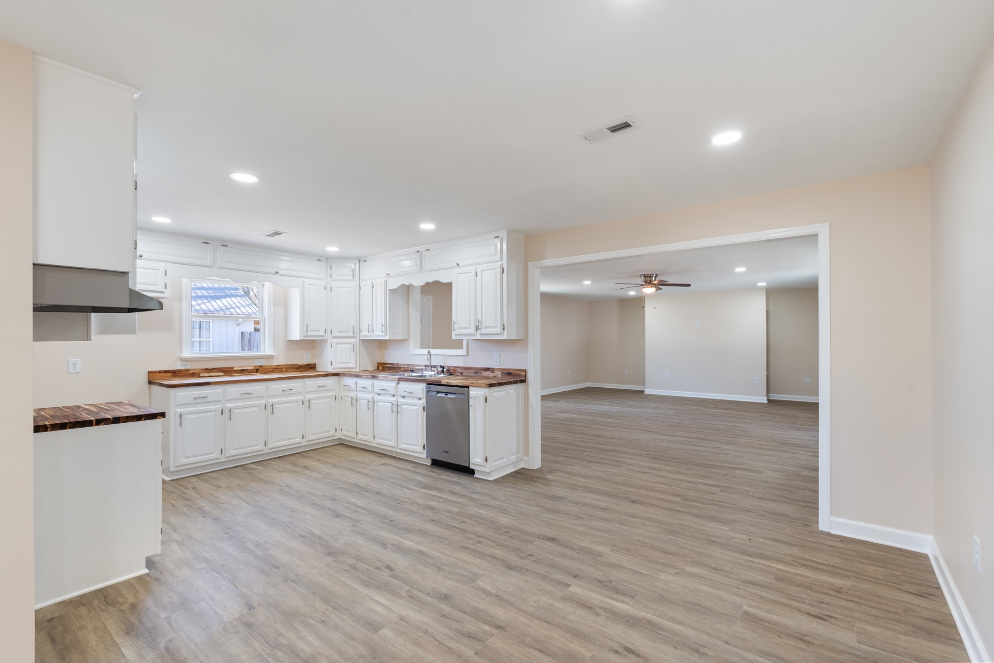 654 West Main Street Hohenwald, TN 38462 - Photo 29 of 33 a large kitchen with a center island and wooden floor