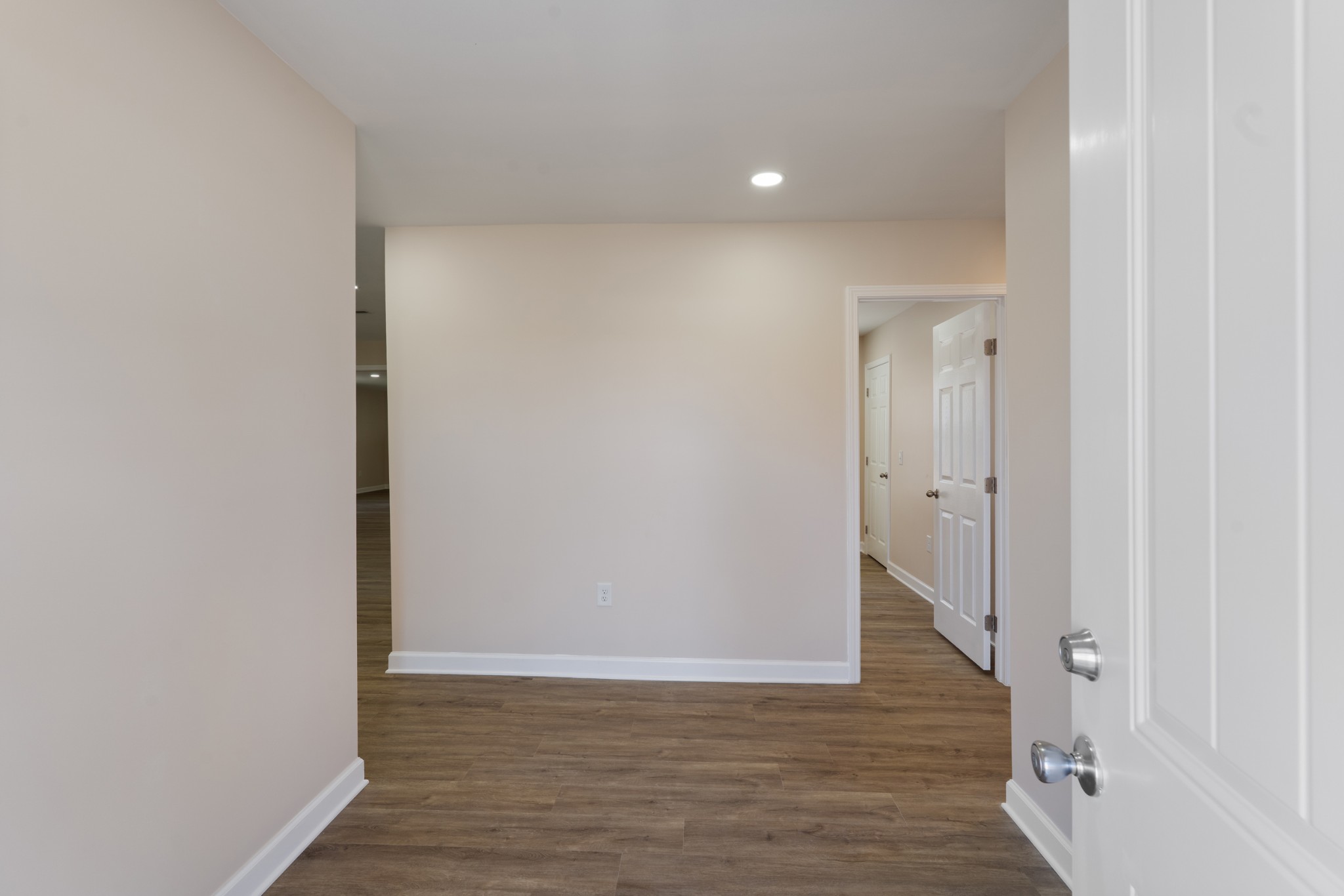 654 West Main Street Hohenwald, TN 38462 - Photo 31 of 33 a view of a hallway with wooden floor